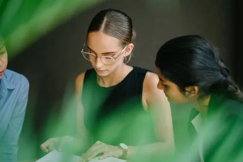 A group of ladies looking at a book