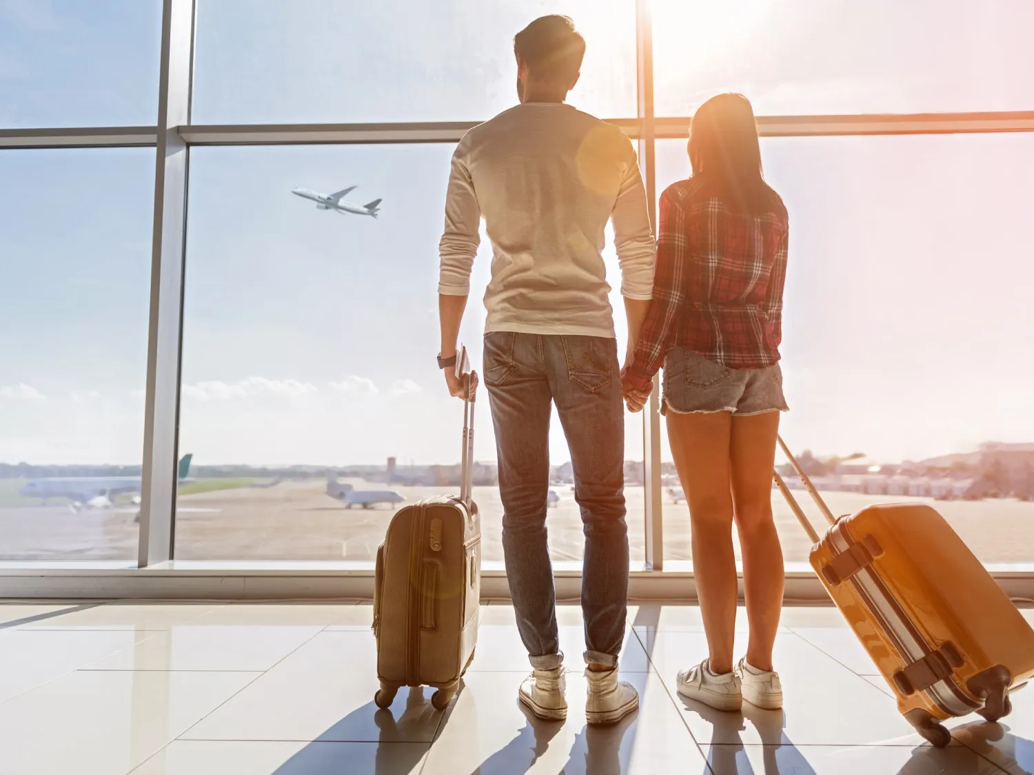 Couple at an airport ready to travel