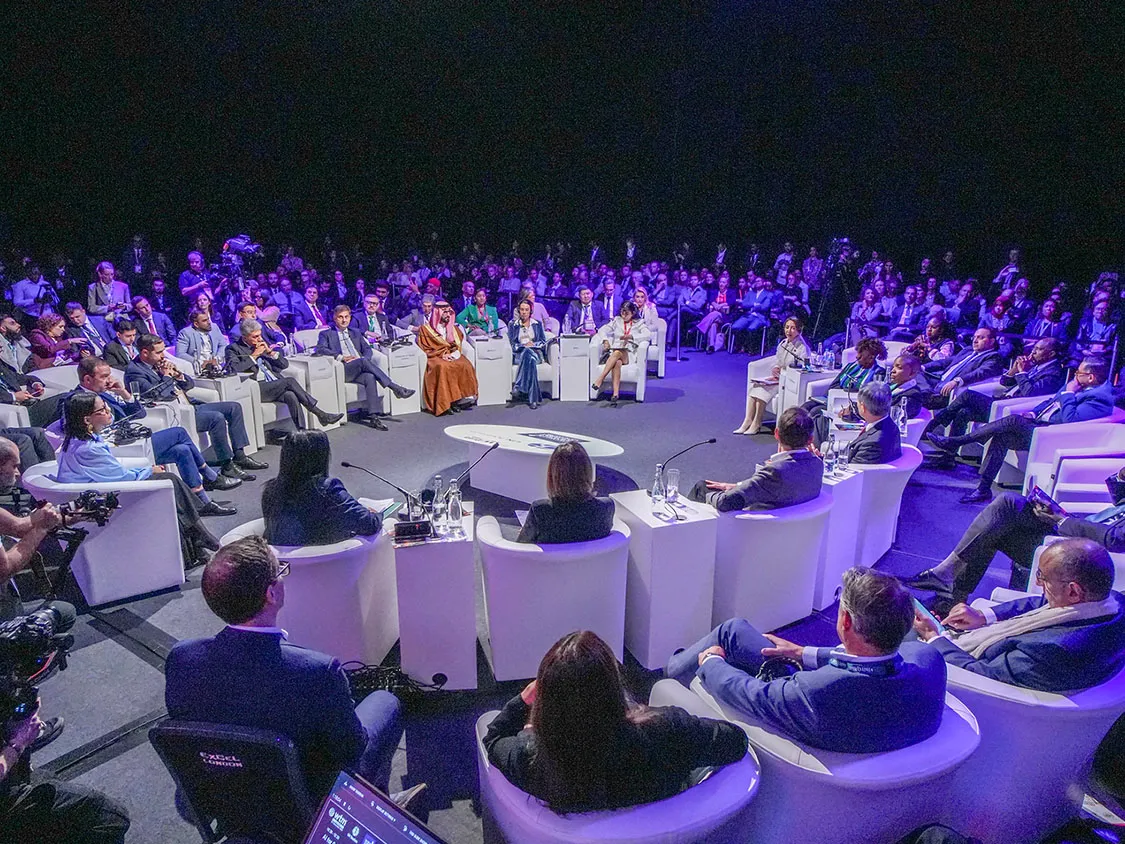 people speaking at an round table event