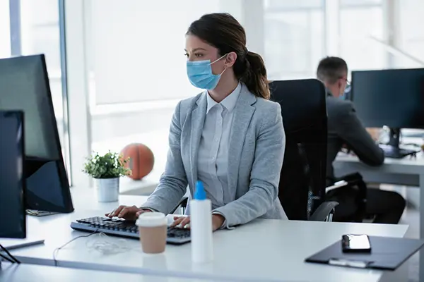 Office worker with a mask