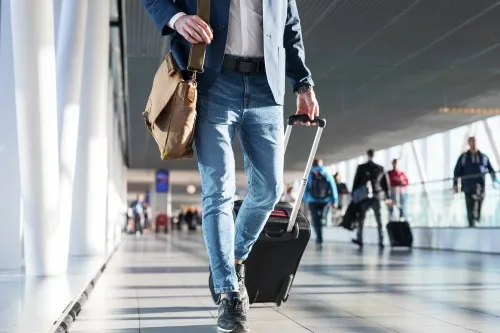 Traveller with a suitcase in an airport