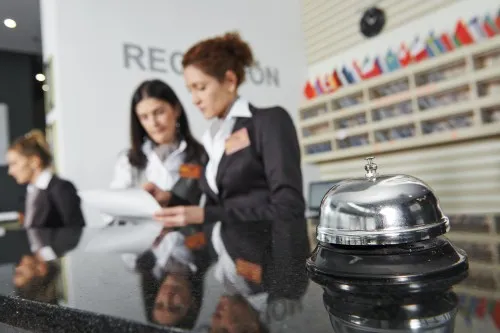 Women working at a hotel reception