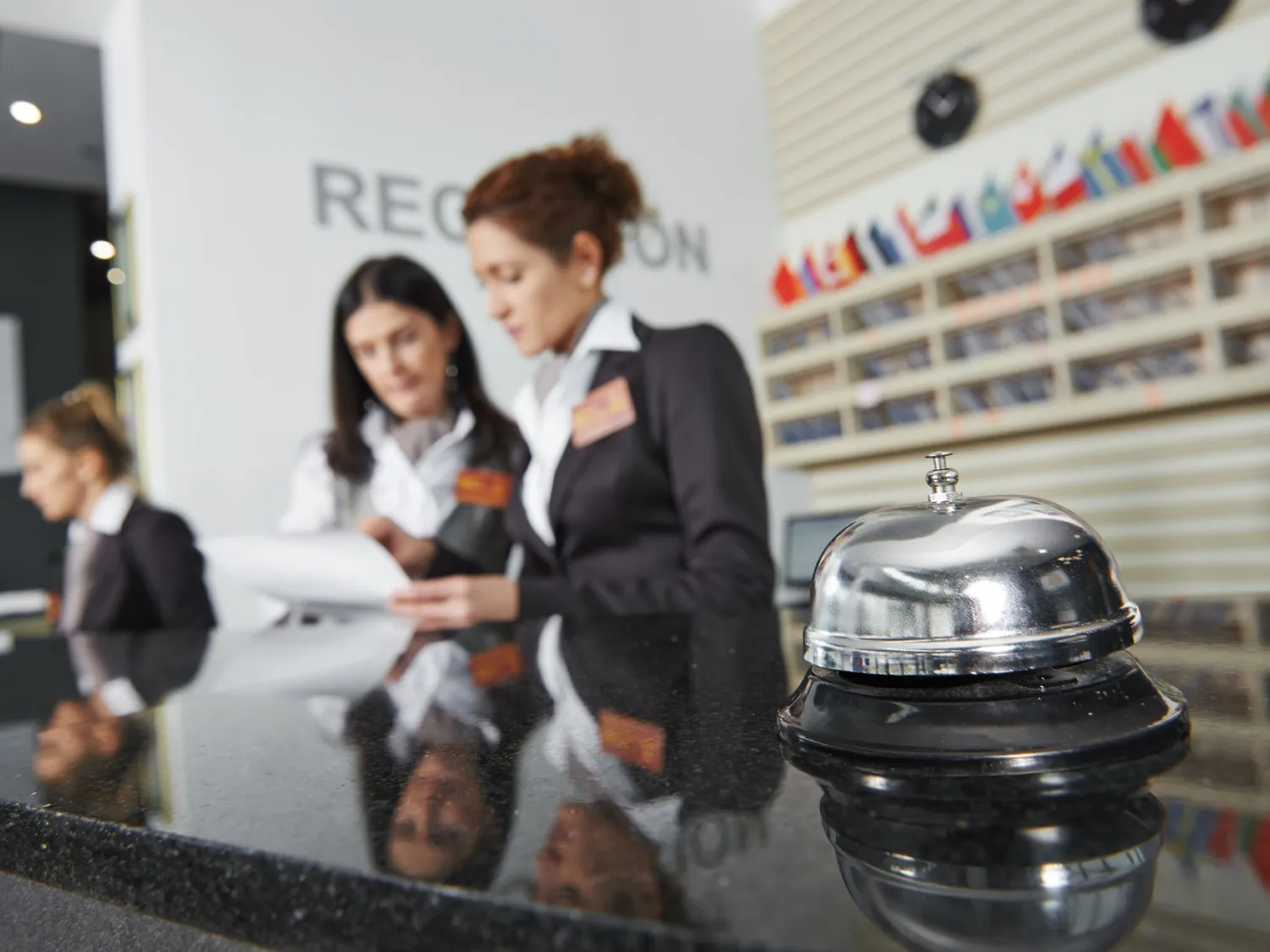 Women working at a hotel reception
